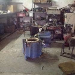 Electric motor stator during rewinding in the workshop